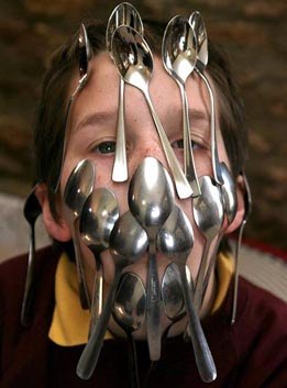 Brit schoolboy breaks world record by balancing 16 spoons on his face