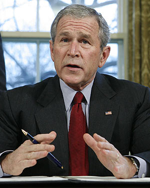 Bush signs terror surveillance overhaul into law