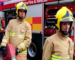 Firefighters rescue elderly couple under piles of trash