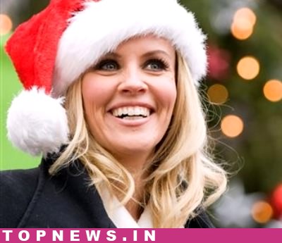 `Festive` Jenny McCarthy poses in bed with Santa hat for racy new shoot