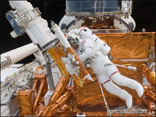 Spacewalkers work on International Space Station 