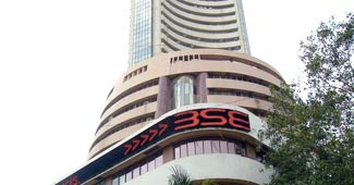 Sensex pares intra-day losses, closes flat