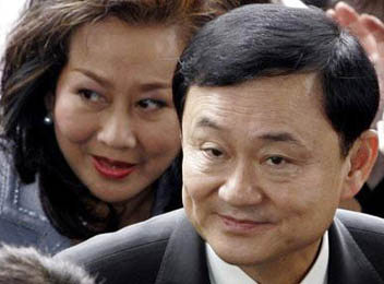 Former prime minister Thaksin Shinawatra and his wife, Pojaman