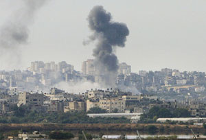 Dozens more airstrikes in Gaza, Israelis to debate truce in Cairo 