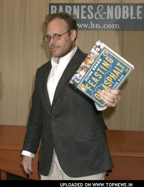 Alton Brown Signs Copies of