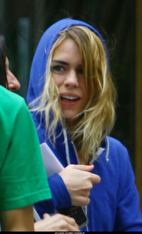 Billie Piper stands outside a production company office after her meeting