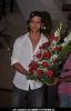 Bollywood actor Hrithik Roshan poses with his birthday cake as he celebrates his 38th anniversary in Mumbai