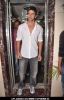 Bollywood actor Hrithik Roshan poses with his birthday cake as he celebrates his 38th anniversary in Mumbai