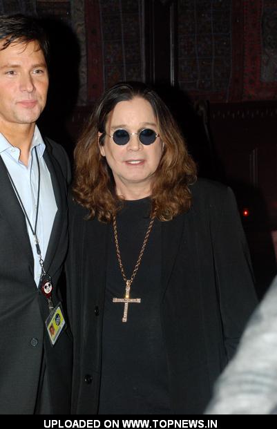 Ozzy Osbourne and Slash Sign 10 Foot Guitar at House of Blues in Hollywood on January 10, 2011 Ozzy Osbourne and Slash Sign 10 Foot Guitar at House of Blues in Hollywood on January 10, 2011