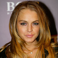 Lohan goes topless for magazine shoot