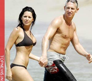 Gary Lineker clings to lover Danielle Bux on Dubai beach holiday