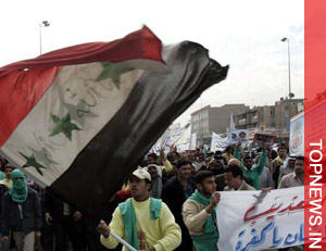 Thousands of Iraqis demonstrate supporting security pact with US