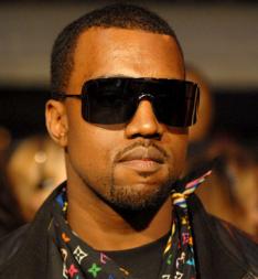 Rap star Kanye West charged in airport fracas 