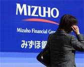 Mizuho Financial halves full-year earnings projections 