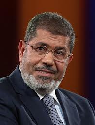 Morsi orders curfew, state of emergency in riot-hit governorates 
