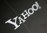Yahoo profit plunges, layoffs announced