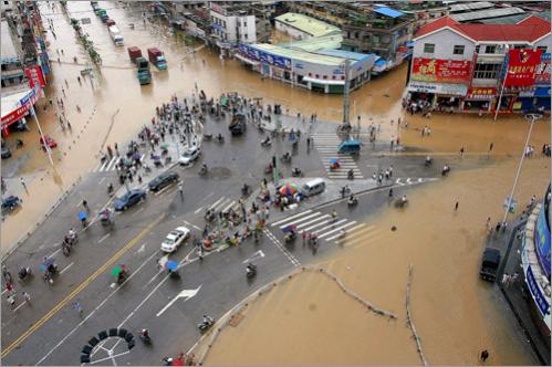 Emergency workers in China trying to rescue people trapped by floodwaters 