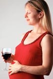 Pregnant woman with wine