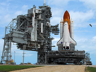 Discovery astronauts installing solar panel on spacewalk