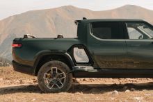 Rivian maintains 2023 production target as quarterly loss declines from $1.59B to $1.35B